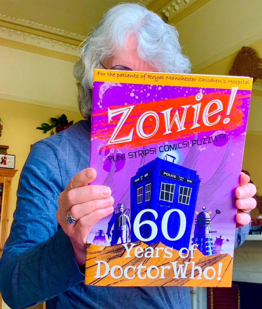 Tim Quinn with a copy of Zowie!, a new comics project for patients of Royal Manchester Children's Hospital, which it's hoped will launch this August. Picture courtesy of Tim Quinn and used with permission