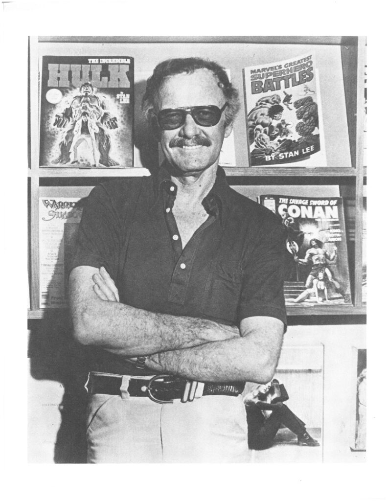Stan Lee posing with some of his comics. Box 7, Stan Lee papers, American Heritage Center, University of Wyoming
