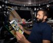 UAE astronaut Sultan Al Neyadi reads The Adventures of Tintin abo the International Space Station. Photo: Sultan Al Neyadi / Twitter