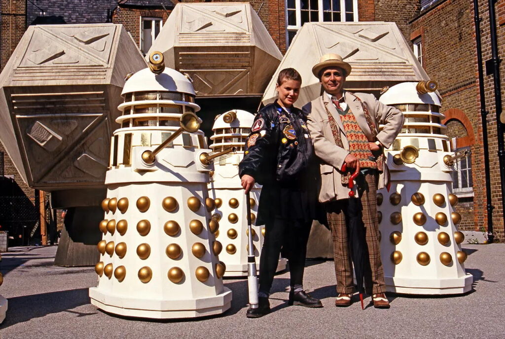 Ace (Sophie Aldred) and the Doctor Sylvester McCoy at Coal Hill School (aka St John's School, Hammersmith), during recording for 1988 story, Remembrance of the Daleks | Photo © Steve Cook