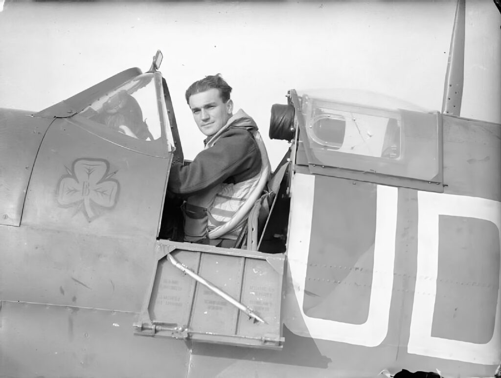 Flight Lieutenant Brendan 'Paddy' Finucane DFC, an Irishman who flew with the Royal Air Force, seated in the cockpit of his Supermarine Spitfire at RAF Kenley while serving with No.452 Squadron RAAF. Photo: Crouch (F/O), Royal Air Force official photographer | Imperial War Museum