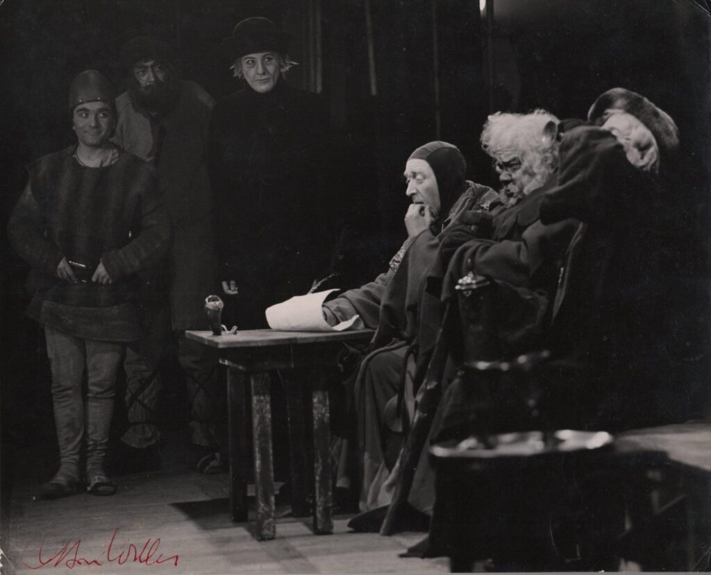 "Jesu! Jesu, the mad times we have spent together." from Shakespeare, adapted by Orson Welles in "Chimes at Midnight", at the Gaiety Theatre in Dublin in February 1960. Seated centre, Orson Welles as Sir John Falstaff at the Inns of Court in the city of London with Justice Shallow, Aubrey Morris and Geoffrey Marsh as the other Justice of the Peace. Standing the motley crew of recruits enlisting for the ragged army, (right centre) Lee Harris as Shadow, Leonard Fenton (who years later played the doctor in East-Enders) and Henry Woolf, who later played Tony Hancock in Heathcote Williams' play Hancock's Last Half-hour).