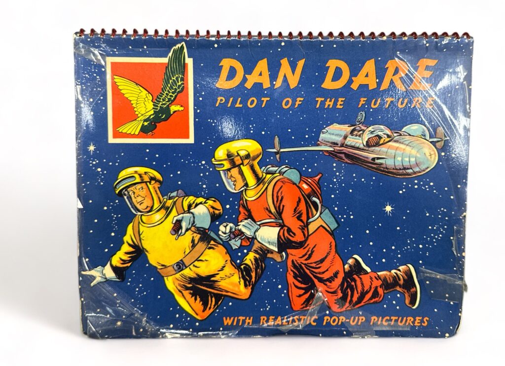Dan Dare Pilot of the Future Pop Up Book, published by Juvenile Productions in 1954. A first edition pop-up book with original spiral binging, some scuff to cover, pop-ups in excellent condition.