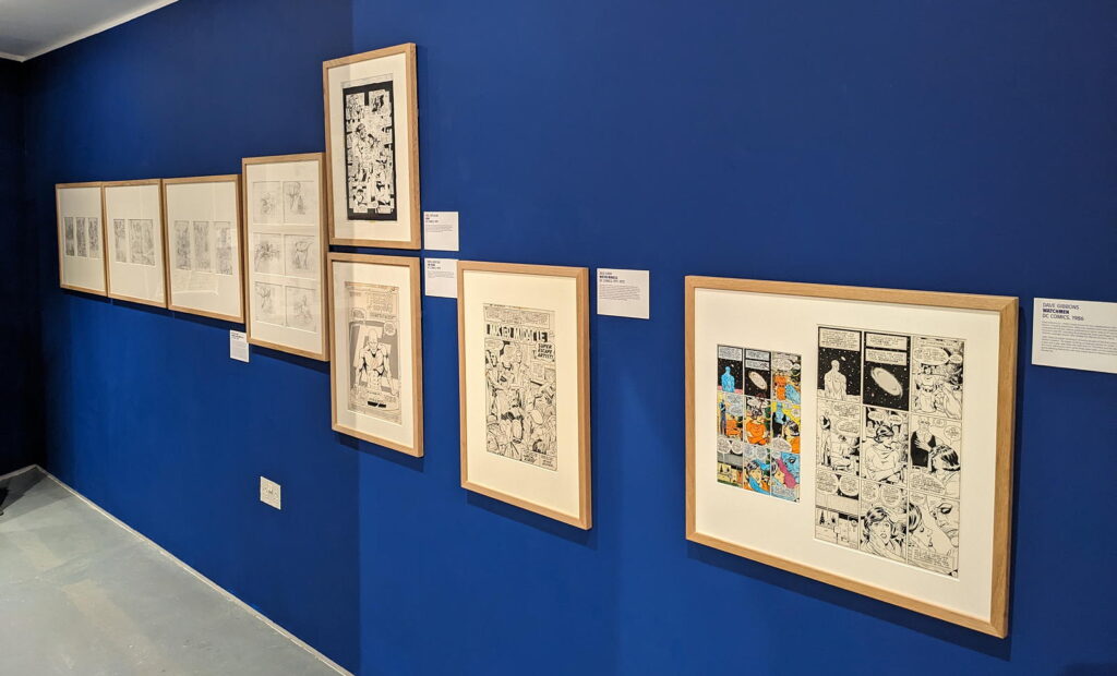 Various artworks forming part of the Cartoon Museum's "Heroes" exhibition (2024)