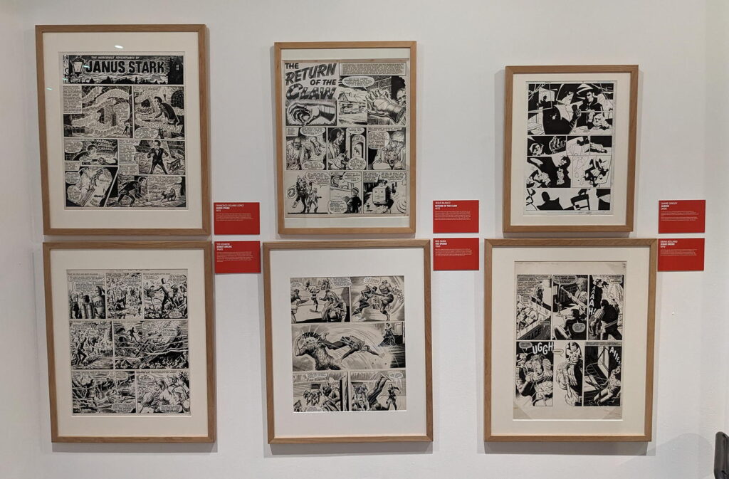 Art for "Janus Stark", "The Steel Claw" and "Judge Dredd", part of the Cartoon Museum's "Heroes" exhibition (2024)