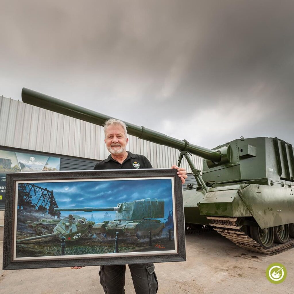 Artist Mick Graham with his original art, “If Giants Ever Met”, also available to preorder now as a print 
