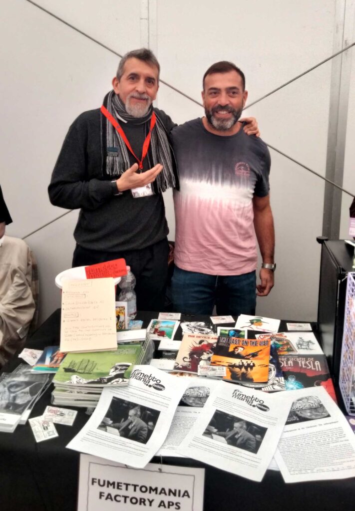 Alberto Conte and Cesare Giombetti from Fumettomania Factory APS on their stand at Lakes International Comic Art Festival 2024