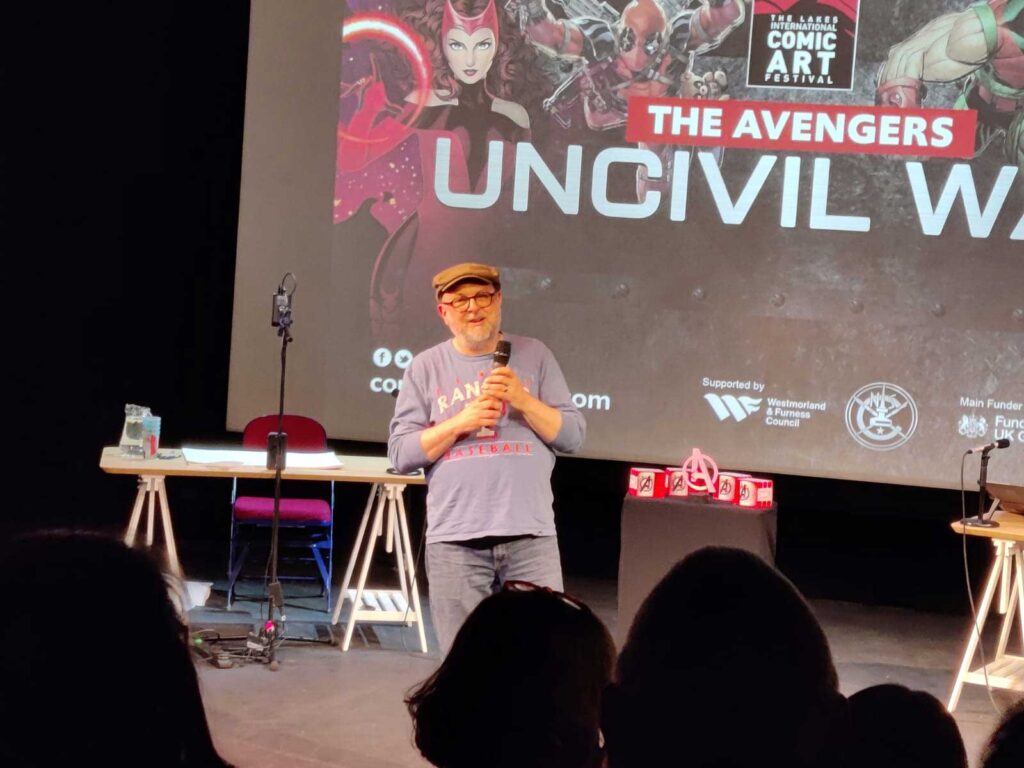 Comic creator Michael Lark channels Captain America in an effort to persuade the audience to vote for him as best Avenger during the opening night event of Lakes International Comic Art Festival 2024