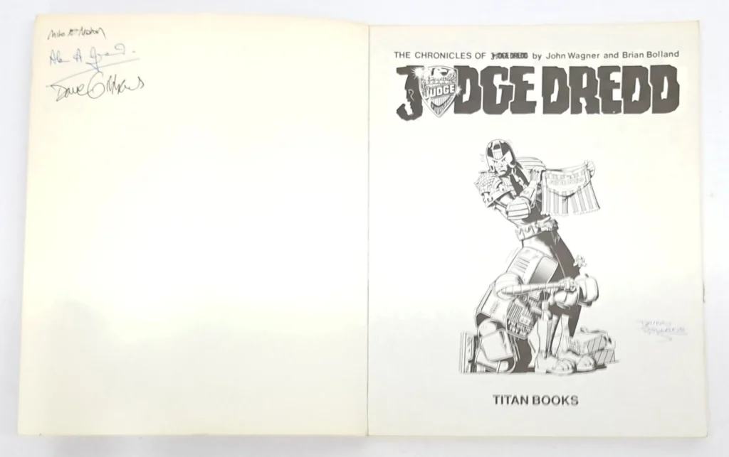 Titans Books “The Chronicles of Judge Dredd” Book Two  Signed inside the front cover by Mike McMahon, Artist, Alan Grant, Writer, Dave Gibbons, Artist & Writer, and Brian Bolland, Cover Artist. Image: Vectis