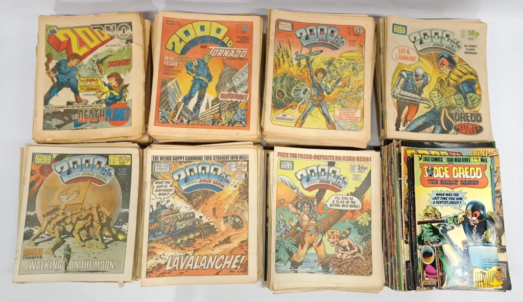 Large Quantity of 2000AD Judge Dredd UK Comics 1970’s to 1980’s.   Includes #72 First Burger Wars, #127 First 2000AD and Tornado, #167 First Appearance of Nemesis, #376 First Appearance of Halo Jones, #411 First Appearance of Slaine & #520 Tenth Birthday New Look Issue. Image: Vectis