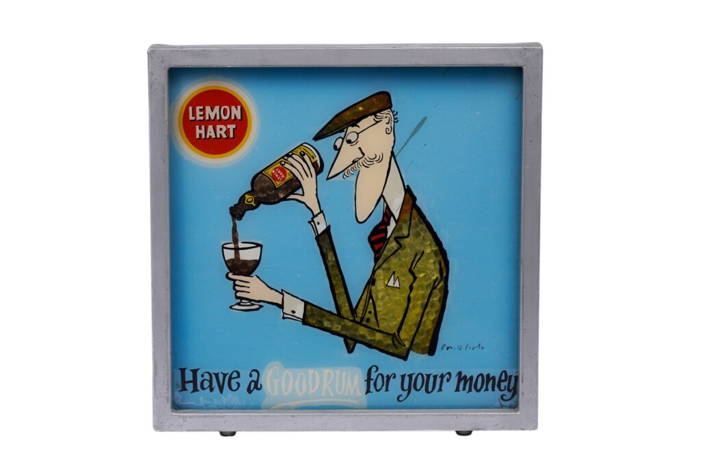 A Vibralux Lemon Hart wall mounted illuminated advertising sign, after Ronald Searle, depicting a gentleman pouring a glass of rum above the slogan 'Have a Good Rum for your money', with Vibralux plaque to the back. Note, the auction house doesn’t claim the art is by Searle