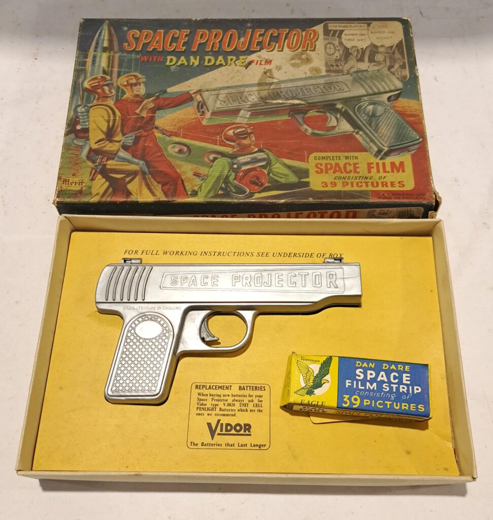 Merit (UK) Dan Dare Space Projector with Dan Dare film - plastic pistol shaped projector. Reel is within inside of gun