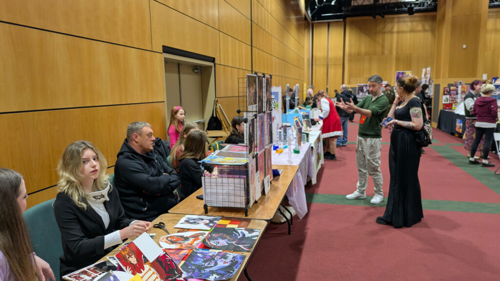 Will Sliney (in the green jumper, centre) encouraging young artists at Dublin Comic Con - Spring 2025