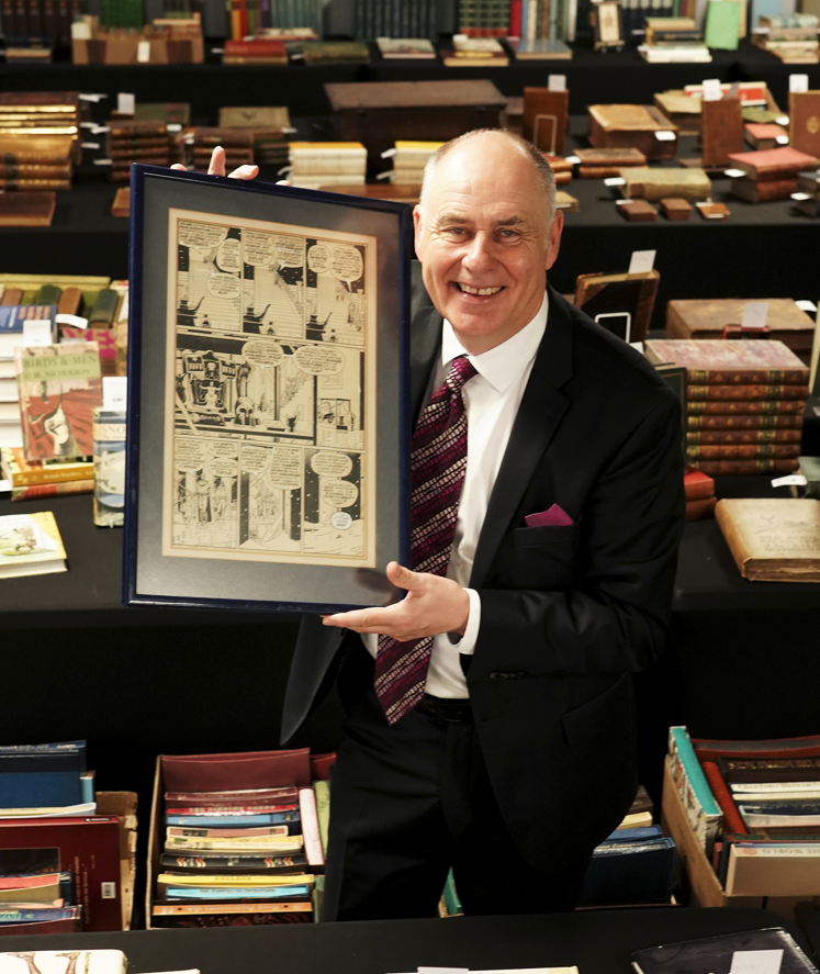 Anderson & Garland auctioneer with Dave Gibbons original art for Watchmen Issue 12, Page 22