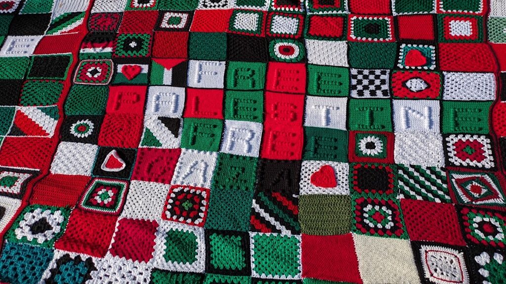 An international quilt of resistance, which has been crocheted in rural Ireland by a group of women and their international allies for Palestinian children killed in Gaza. Photo: James Bacon