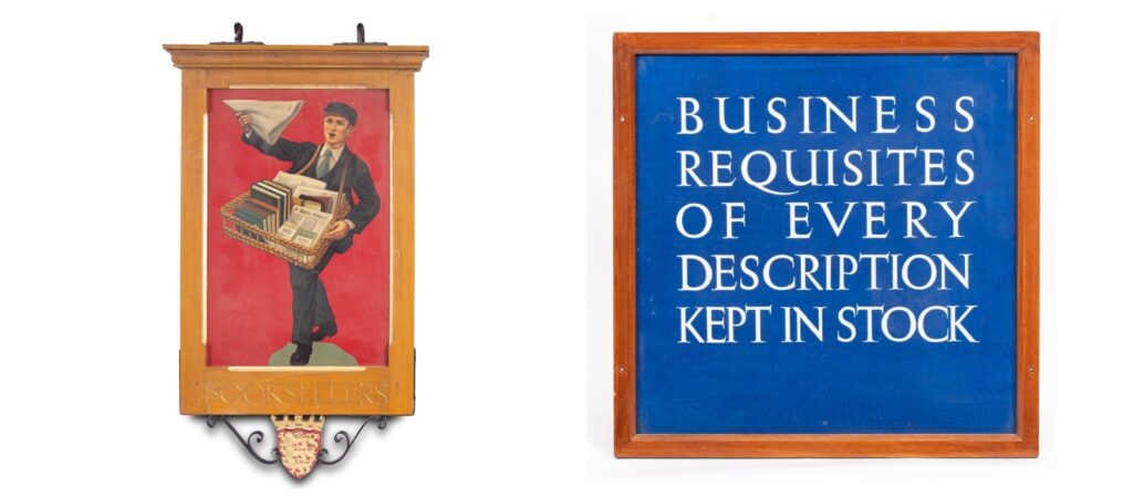 A W. H. Smith painted 'Newsboy' hanging sign within a pale oak finished framed with fluted gilt details, the top fitted with hanging hooks and the underside with wrought iron brackets centred by a painted metal English heraldic shield of three gilt lions on a red ground, double sided, 85cm wide, 13.5cm deep, 139cm high (excluding hooks), one side with 'Booksellers', the other side with 'Stationers' Also: A large tiled W. H. Smith advertising sign of two pictorial panels and centred by a blue ground text panel 'Newspapers Books and Periodicals sent to all parts of the World', in original oak frame, 45.5cm x 146cm, with frame 79cm x 156cm. Pictorial and lettered tile panels in an Art Deco style adorned many exteriors of W H Smith’s distinctive recessed shopfronts in the 1920s and 1930s. Produced by Carter & Co in Poole, the panels advertised particular services, goods and those with a pictorial element advertised book categories such as Travel, Literature, etc. Many included the font designed for the company by Eric Gill.