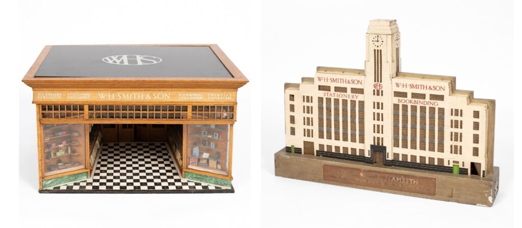 An architectural model of the W. H. Smith building, Bridge House, Albert Embankment, 1930s, designed by Herbert O Ellis & Clarke and ‘Architect to W. H. Smith’, F. C. Bayliss, 1930s, finished front and back and painted with signage, the painted base applied with a painted plaque 'Bridge House . Lambeth . The New Stationary Factory of W. H. Smith & Son', the interior of the base fitted for a lighting tube, 69cm wide, 13cm deep, 51cm high. Opened in 1935, ‘Bridge House’, which stood on London’s Albert Embankment was designed and built for the booksellers, W. H. Smith & Son, Ltd. Located immediately south of Lambeth Bridge (1929-1932), the building was demolished without resistance in the 1970s and since that time has been almost entirely forgotten about, despite being one of the best examples of interwar ‘factory’ buildings to have been built in London. The building was intended to serve as both a stationery factory and book-binding workshop, allowing Smith’s to consolidate three existing west end buildings into one. Also: a late 19th Century oak and painted model of a W. H. Smith high street store, an applied label to the side reading ‘This model of a typical W. H. Smith and Son shop is made to the scale of one inch to one foot’, the reverse applied with miniature advertising posters, with a loose brass plaque ‘Presented by W. H. Smith, Esq., M.P., 1873', the WHS logo in painted glass to the top, 67cm wide, 51.5cm deep, 37.5cm high, on a later display stand. Likely designed with the involvement of W. H. Smith in in-house architect Francis Charles Bayliss, F.R.I.B.A. (1876-1938). Between 1905 and 1938 Bayliss was the design coordinator for W.H. Smith & Son and responsible for the design of all shops and retail outlets.