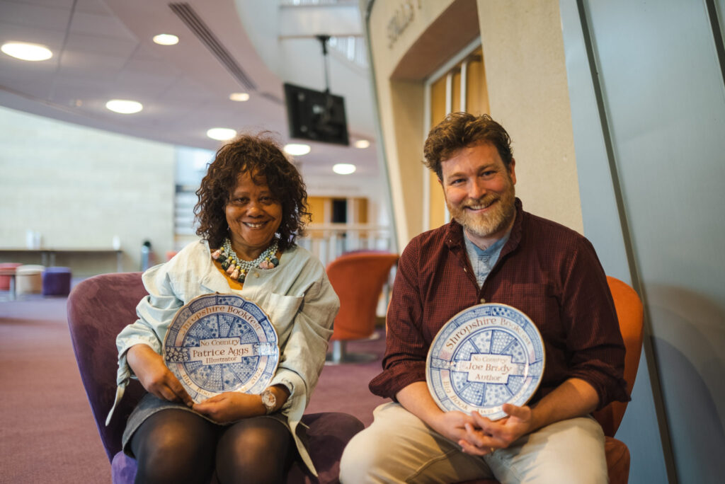 Patrice Aggs and Joe Brady at Bookfest Shropshire in 2022, with their Big Book Award plates. Photo: Bookfest Shropshire