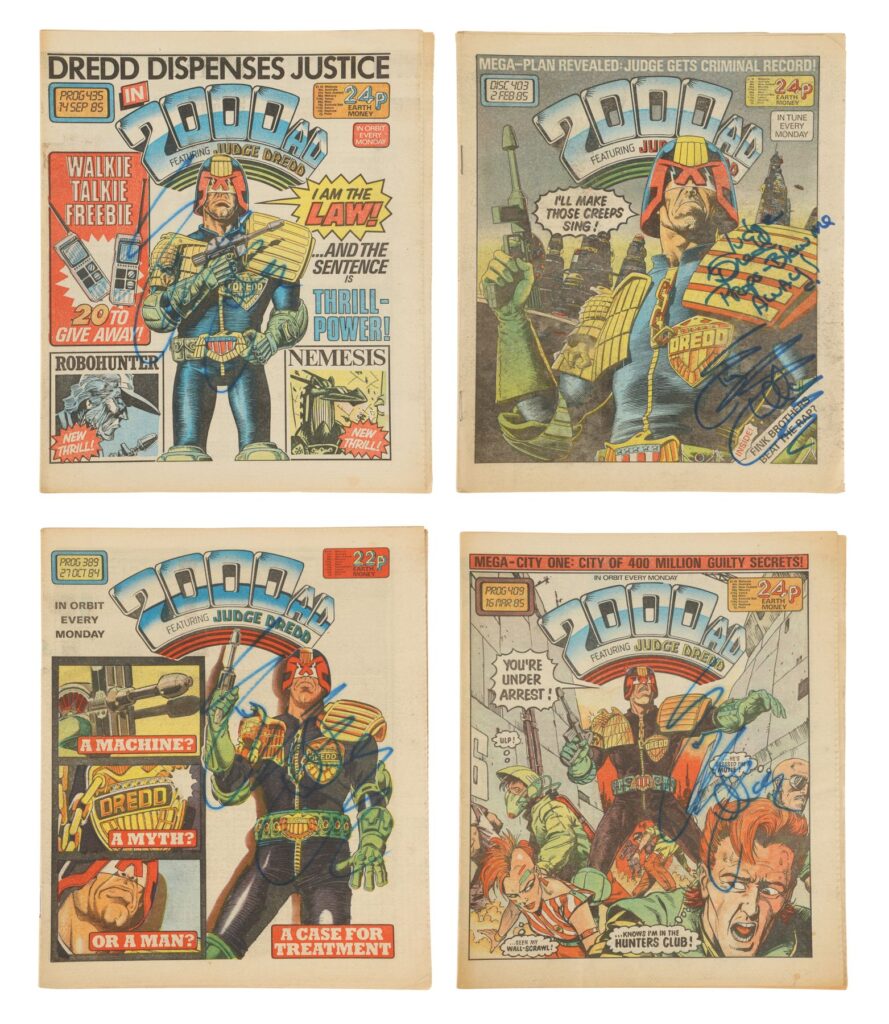A set of four 2000AD comics autographed by Sylvester Stallone on the production of Danny Cannon's sci-fi action film Judge Dredd