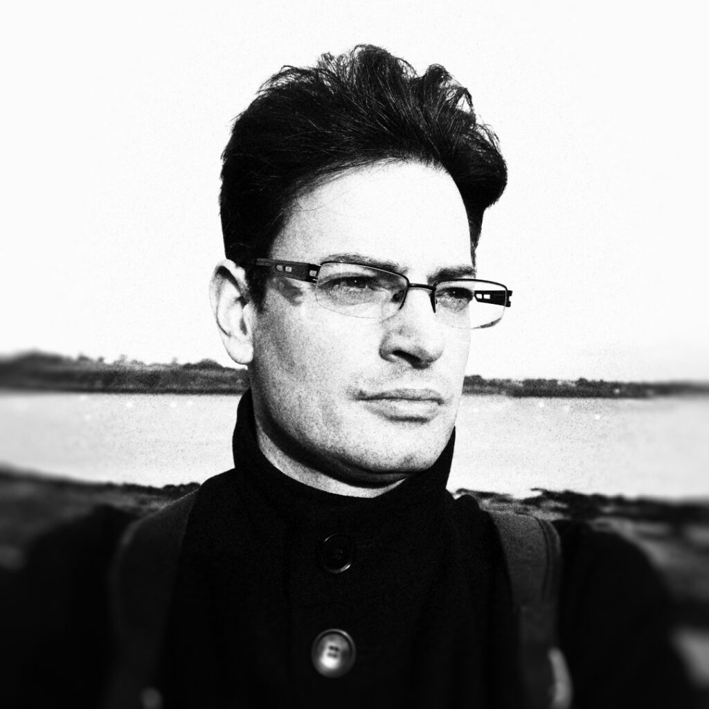 Alex Storer is a Sheffield-born graphic designer, illustrator, musician, and occasional writer with a lifelong passion for music, Doctor Who, and science fiction