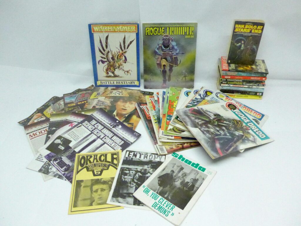 This collection of fantasy and sci-fi gamebooks and novels includes Knightmare, early Star Wars fiction, The X-Files, and more, along with a Warhammer Battle Bestiary, Doctor Who and Star Wars fanzines, 1990s 2000AD and Judge Dredd comics, and TV Zone magazines