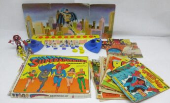 A collection of predominantly comic book related toys and games including DC Superadventure Colorforms set, unboxed Batman Shoot Out game, Transformers Classics 'Cliffjumper' figure, Star Wars Boba Fett Attacktix figure, Power Rangers figure, Star Wars cereal box cutouts, and a quantity of comics including Spider-Man Comics Weekly, Topper, Beezer, TV Comic, and more.
