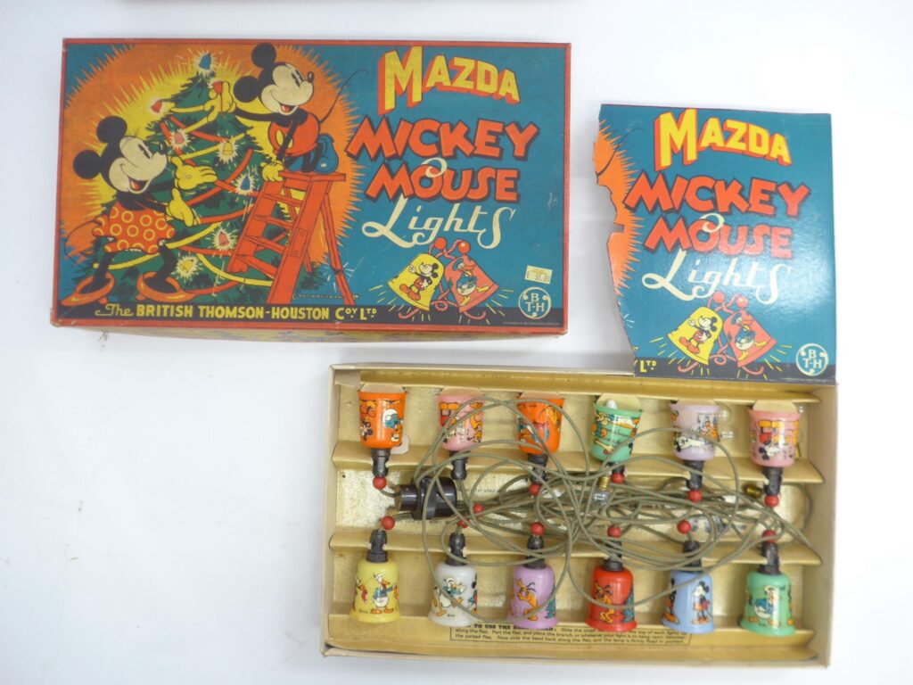 Two 1940s Walt Disney Mickey Mouse Mazda Christmas Lights sets by The British Thomson-Houston Co Ltd. Housed in pictorial lidded card boxes