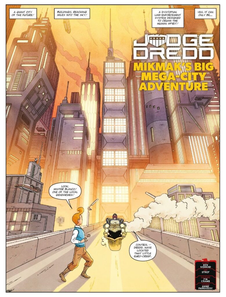 2000AD Prog 2463 - JUDGE DREDD // MIK-MAK'S BIG MEGA-CITY ADVENTURE
by Ken Niemand (Writer) Stref (Artist) Fin Cramb (Colourist) Annie Parkhouse (Letterer)