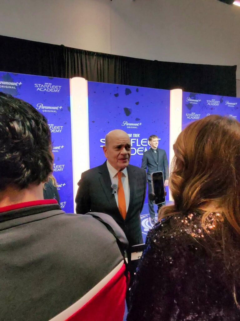 Actor Robert Picardo chats with press. He told Collider he’s hoping there might be a way to bring his fellow Star Trek: Voyager crew into the show as guests in Season Two, despite the different time period of both shows