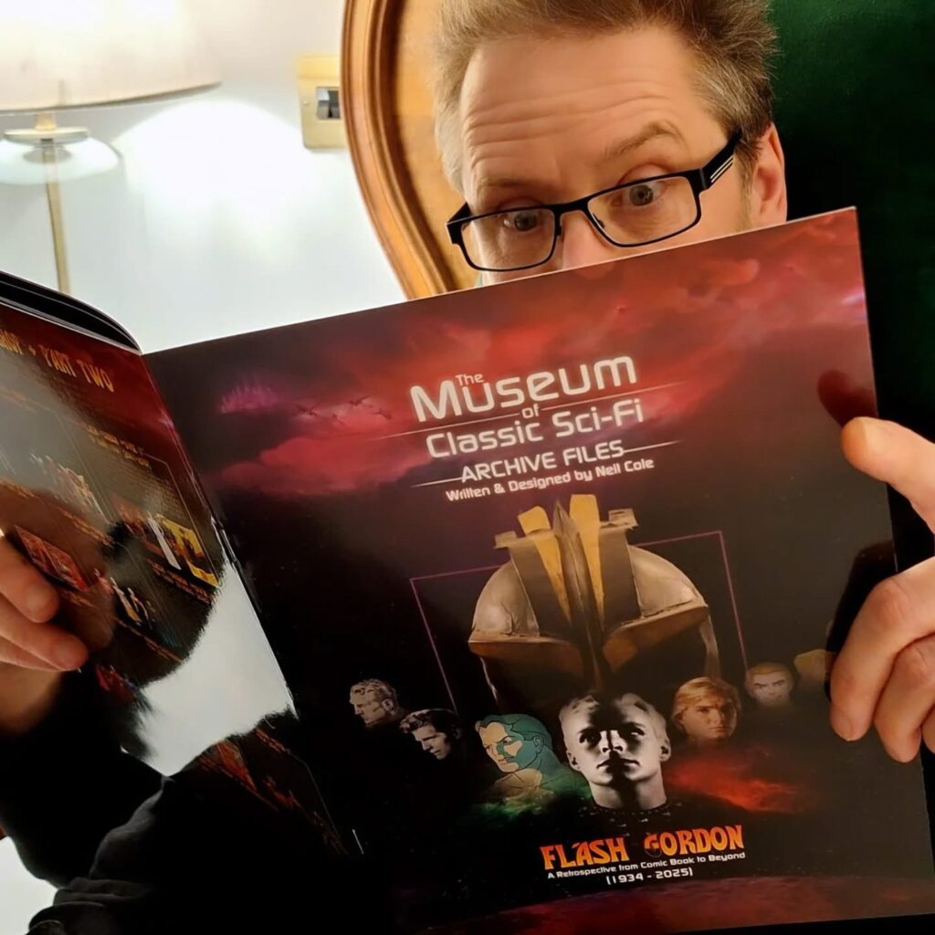 Artist and Museum of Classic SciFi curator Neil Cole with his latest publication 