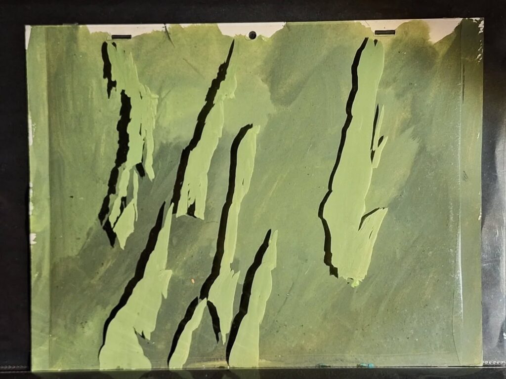 A Filmation animation cel of some Hawkmen flying past a mountain range on the planet Mongo! “I had no idea that Filmation would build up their background artwork as a series of acetate layers in addition to placing the acetate cels over them,” says Neil Cole