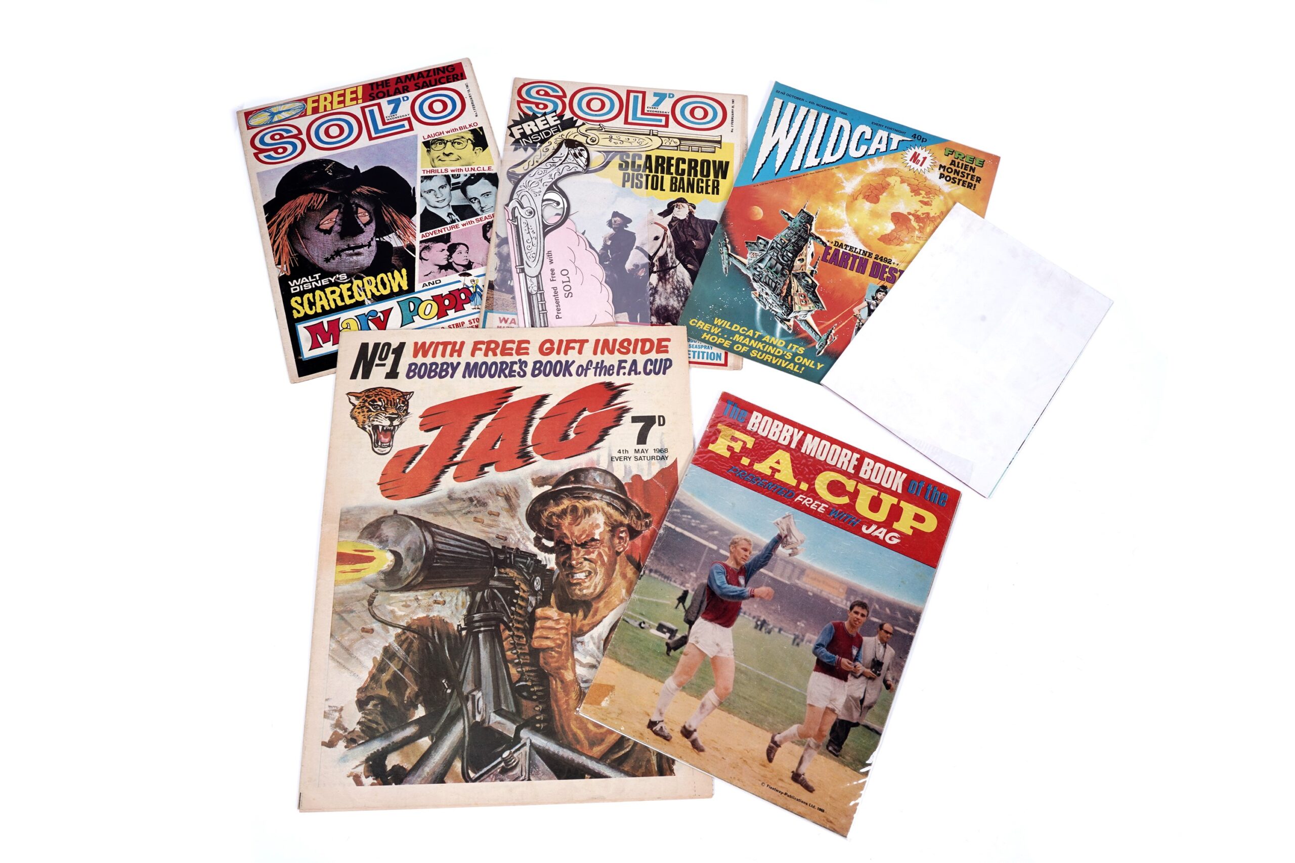 Solo Weekly Comic No. 1, February 18th 1967; Solo No. 2, February 25th 1967, with free “scarecrow pistol banger”; Wildcat Fortnightly Comic No. 1, 22nd October 1988, with free alien monster poster; and Jag No. 1, 4th May 1968, with free Bobby More Book of the F. A. Cup giveaway.