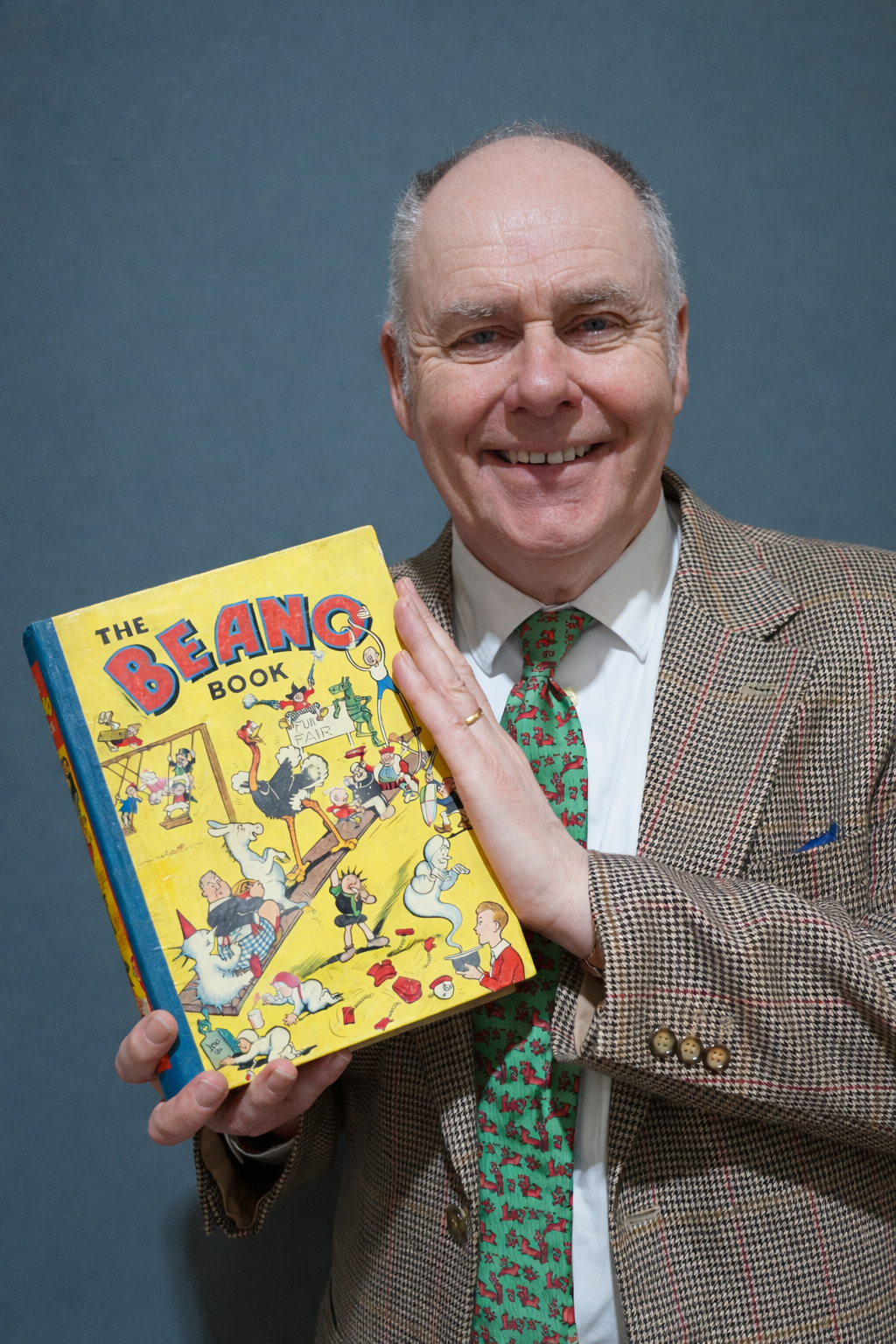 Auctioneer John Anderson with a copy of Beano Annual No.1 - sure to attract plenty of bids