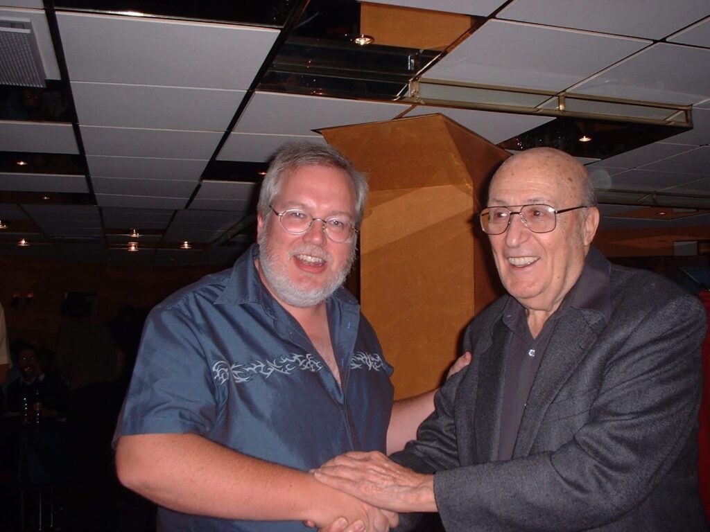 British comic creator Mike Collins with Will Eisner at Raptus in Bergen, Norway, in 2003. Other guests at the event included John Cooper, Carlos Ezquerra, John Freeman and Pat Mills