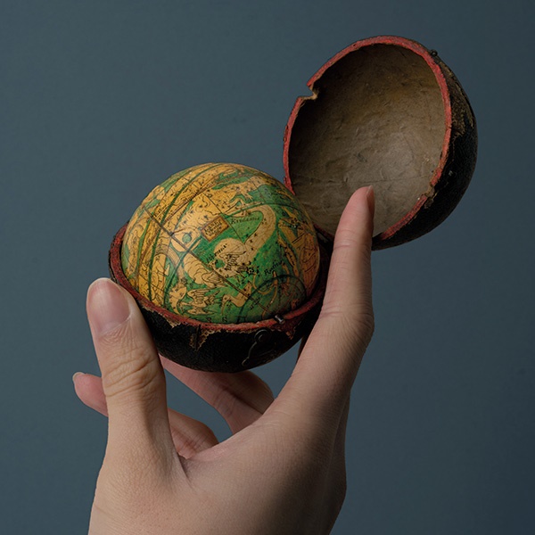 Lane’s Celestial Globe, 1811. 3 inch pocket globe, with 12 hand-coloured engraved paper gores, calottes at poles, and paste-over rectangular title cartouche, the night sky coloured blue (except for along ecliptic line) with constellations left uncoloured, over plaster sphere, varnished, axis pivots, housed within original shagreen clamshell case, with hooks and eyes, plain paper interior lining, surface abrasion to Ursa Minor figure, some loss to case cover. Nicholas Lane (fl. 1775 - 1783), was particularly associated with the production of a pair of pocket globes in about 1779, with gores derived from those designed by James Ferguson (1710 - 1776). The globe was updated in 1807 by his son Thomas Lane (fl. 1801 - 1829), who continued to revise the globe up until the 1820s. Pocket globes’ lack of precision made accurate calculations impossible and makers continued to use pictorial constellation figures, even after they fell out of use on larger, scientific globes. Pocket globes were therefore more likely to serve as status symbols or educational aids.