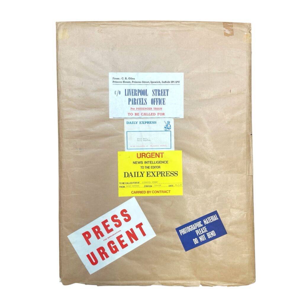 Giles (Carl Ronald Giles O. B. E.) - packaging for cartoon depicting the Daily Mail “Got a right one here, Sir - claims he’s in the first three for the £5 crossword prize.”, depicting a scene outside the editor's office at the Daily Mail, signed lower left, ink and wash on board, inscribed label to mount: “To Harold - from ‘Giles’ ‘82. May the brilliance of the wit compensate for the absence of the artistry!”, image 31 x 48 cm, overall 47 x 65 cm, within the original parcel paper featuring ‘Press Urgent’ and ‘Liverpool Street Parcels Office per passenger train’ labels, and addressed to Harold Keeble as editor of the Daily Express, 24th of February, 1982. ***Giles refused to work from Fleet Street, instead sending each cartoon by train from his home in Ipswich to Liverpool Street Station. His process of drawing cartoons on the day often caused headaches for editors on a deadline.