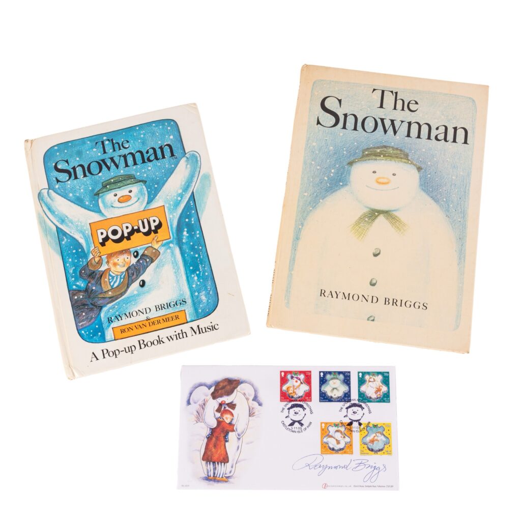 “The Snowman”, First Edition, hardback, by Raymond Briggs, 1978; and The Snowman. Pop-up Book, first edition, a fine copy, 1982; offered with a First Day Cover dedicated to the Snowman, signed in blue ink by Raymond Briggs, postmarked Castletown, Isle of Man, 5th November 2003