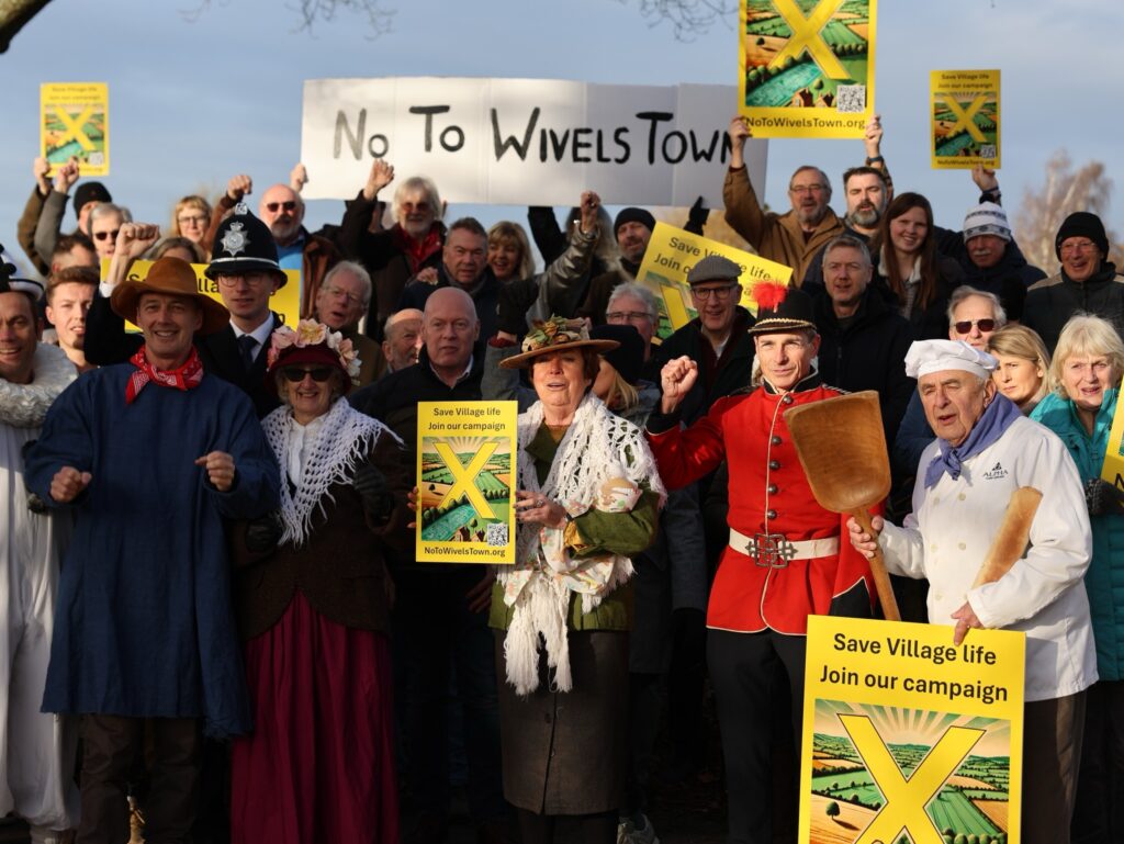 Residents in Wivelsfield Green dressed in Camberwick Green costumes to protest about housebuilding plans for the village earlier this year. Image via No to WivelsTown