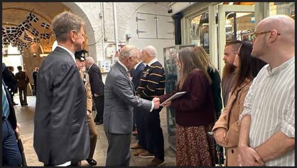 King Charles III outside Into the Realm in St. Austell. Photo via Trystan Mitchell