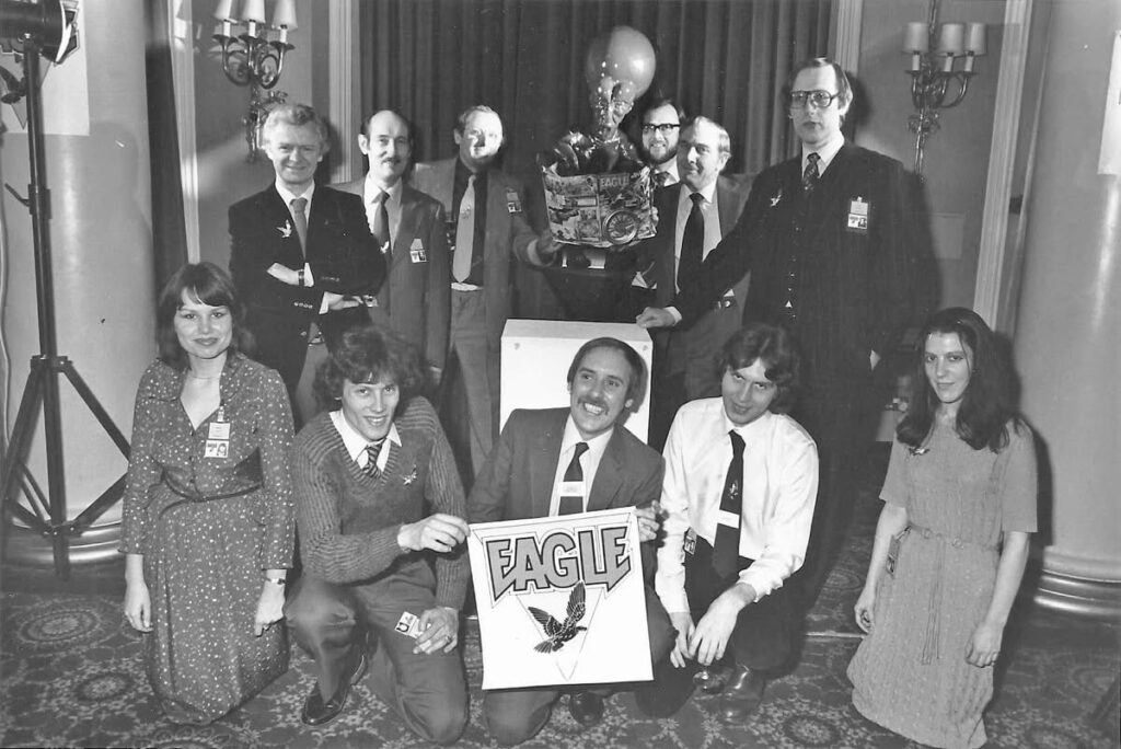 "New" Eagle staff at the comic's launch in 1982. Back row (I-Jack Cunningham (art staff), John Jackson (art staff), Doug Church (art editor). Roy Preston, Sid Bicknell, Barrie. Front row (l-r) Debbie Watts (secretary), Paul Bensberg (art staff), David Hunt (editor), lan Rimmer (assistant editor) and Janet Dixon (sub-editor). Photo with thanks to David McDonald of Hibernia Comics