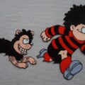 Dennis and Gnasher TV Series Animation Cel (1996), from the DC Thomson Archive. This is the first time any such cels from the two series have been offered for sale. This item has officially come from surplus material held by the DC Thomson Archive. Dennis and Gnasher was an animated TV series broadcast on BBC from 2nd April 1996 until 7th May 1998. Re-runs aired on CBBC until January 2007. The series was produced by Collingwood O'Hare Productions and DC Thomson, in association with BBC Television. Largely written by Tony Collingwood, two series were made with 13 episodes in each, making a total of 26 episodes, running for 25 minutes each. The series focussed on Dennis the Menace and Gnasher, with voiceovers from voice actors and features the likes of Dennis' Mum and Dad, Granny, Curly, Pie-Face, Walter the Softy, and Foo Foo, amongst other smaller part characters based on the famous comic strip in The Beano.