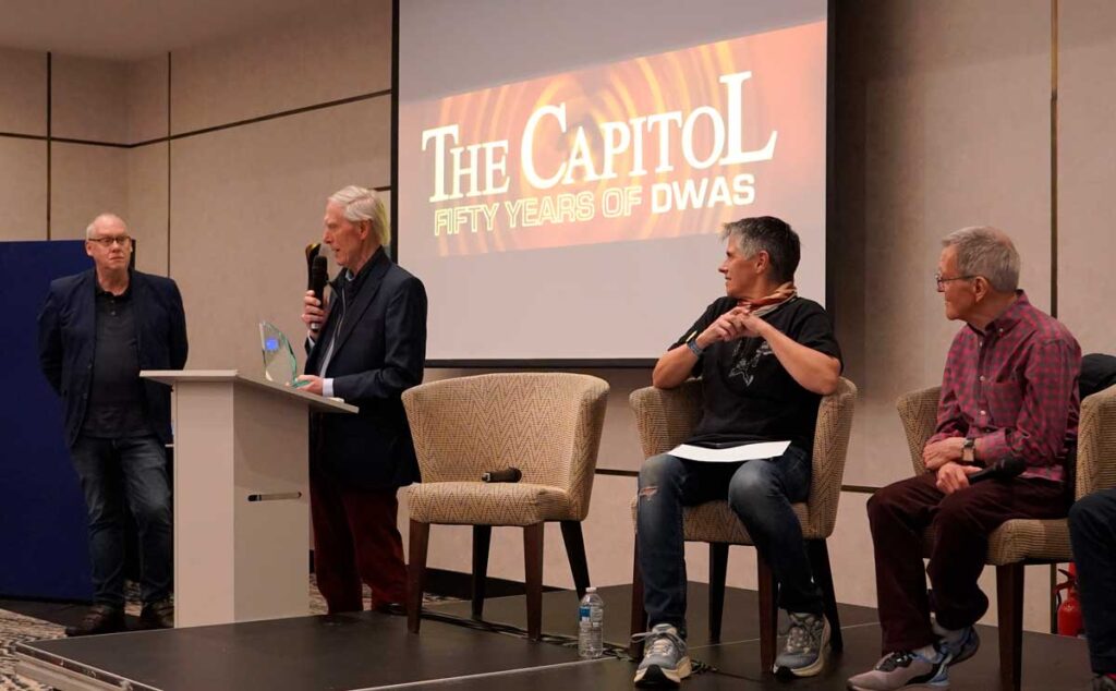 Doctor Who convenor Tony Jordan looks on as former producer Philip Hinchcliffe accepts the award for "Best Ever Story", for Genesis of the Daleks, at Capitol 50. Photo: Andy Richards