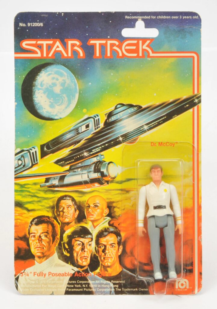 Mego Corp Star Trek Dr. McCoy 3 3/4" vintage figure, within Good Plus to Excellent clear bubble, on Good Plus card back, with creasing and bending