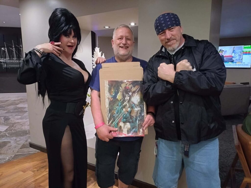 Elvira (Jo Alexander) and the winning bidder Robert Cox with Andrw Sawyer