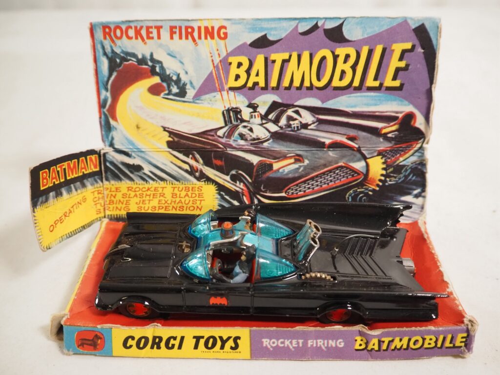 CORGI 267 Rocket Firing Batmobile, complete with Batman and Robin figures (missing missiles) - E in F/G box (complete with internal packaging) and F/G picture stand