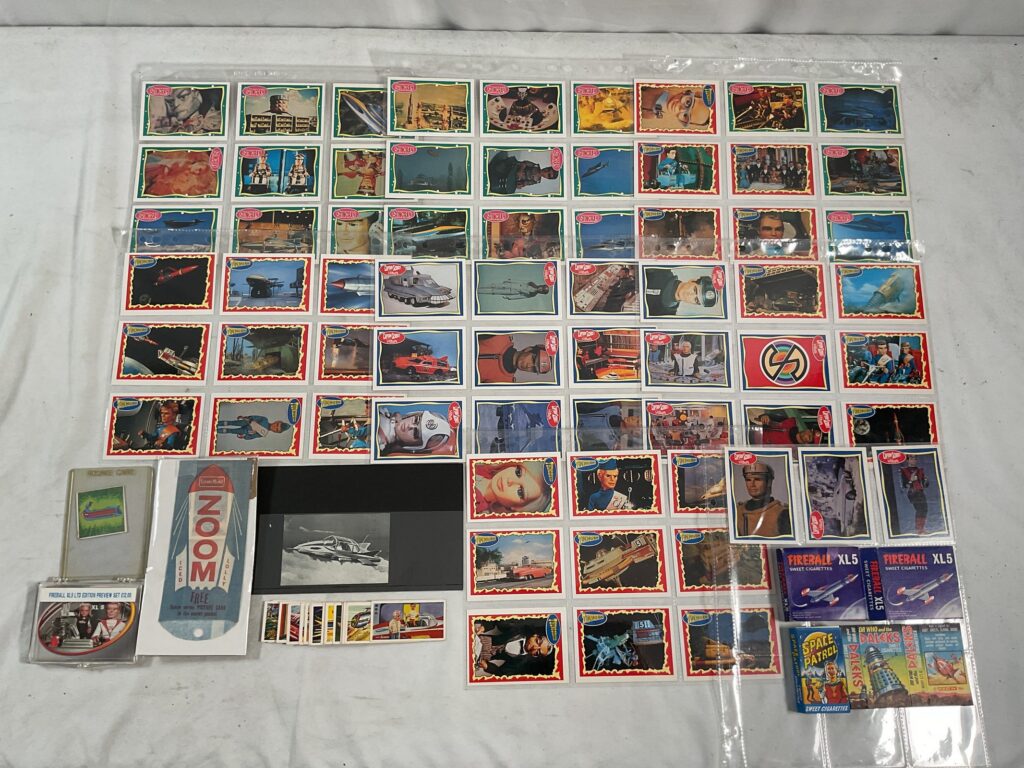 Gerry Anderson's 'Captain Scarlet' Trading Cards comprising: ANGLO CONFECTIONERY, 2 x complete sets of 66 large-sized cards, plus 17 duplicates together with BARRATT'S SWEETS CIGARETTES - 33 out of set of 50 and a pack sleeve from the original sweets - G/VG (Q)