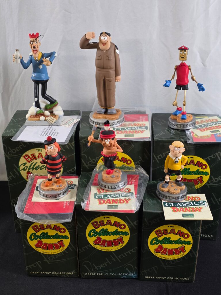 Robert Harrop boxed resin figurines from the Beano and The Dandy collection comprising CBD10 'Smiffy', CBD03 'Minnie the Minx', CBD23 'Little Plum', CBD25 'Corporal Clott', CBD19 'Brassneck' and BDCS06 Christmas Limited Edition 'Teacher 5th Day of Xmas!' - VG/E in G/VG boxes (6)