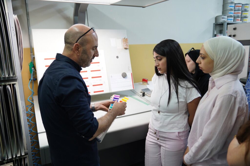 From paper... to print: As part of developing the training program for Qusasat, artists learned about the journey of book production from the inside, through a visit to Noor Printing House in Bethlehem, where David Noor led a masterclass on transforming a digital file into a printed book