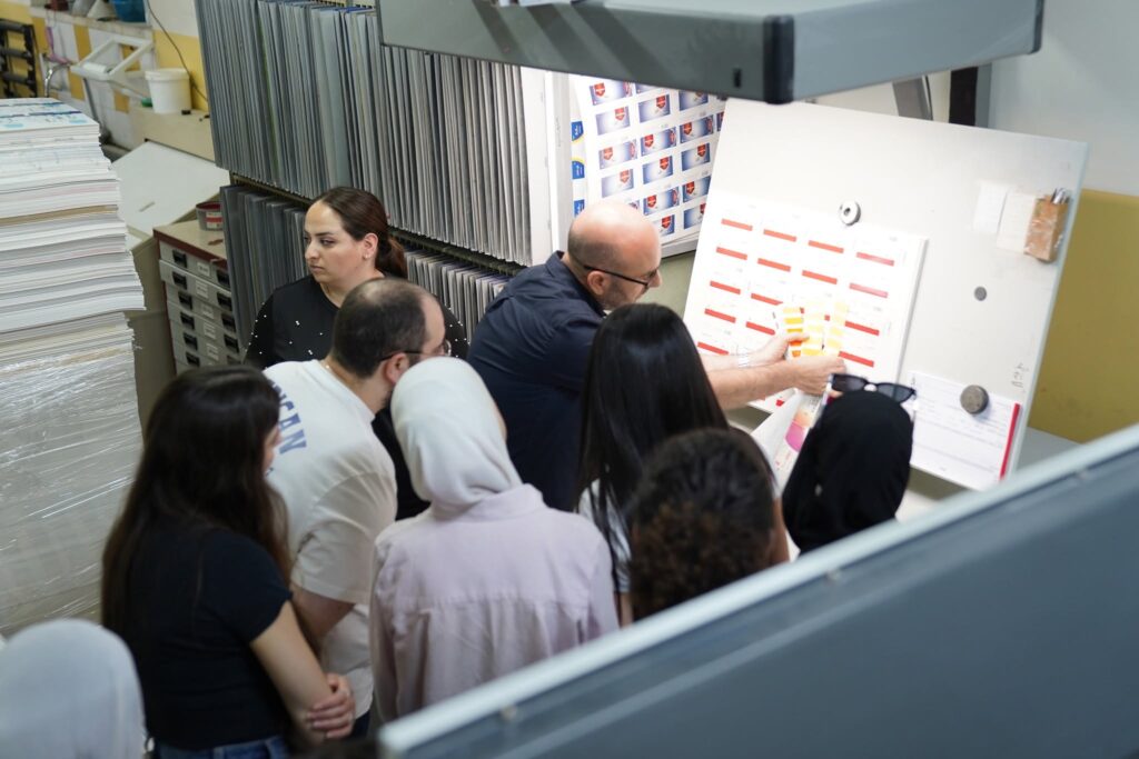 From paper... to print: As part of developing the training program for Qusasat, artists learned about the journey of book production from the inside, through a visit to Noor Printing House in Bethlehem, where David Noor led a masterclass on transforming a digital file into a printed book