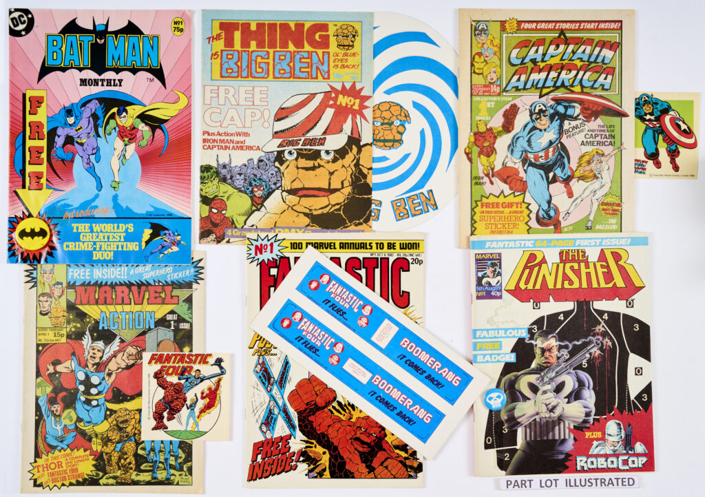Superhero 80s No 1s most wfgs. Batman 1 wfg Bat Badge, Big Ben 1 wfg Cap, Captain America 1 wfg Superhero Sticker, Fantastic Four 1 wfg FF Boomerang, Incredible Hulk 1 wfg Hulk cardboard model, Marvel Action 1 wfg FF Superhero Sticker, Blockbuster 1, Punisher 1 wfg Badge, Savage Action 1, Marvel Super Heroes Secret Wars 2 wfgs Poster and Captain America Sticker, Super Adventure 1 wfg Black Panther Sticker, Marvel Team-Up 1, Valour 1, 2, both wfgs Devil Dinosaur Jigsaw parts and X-Men 1 wfg Spinner Gun [fn/vfn+] (15)
